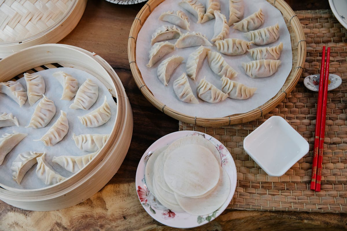 Handmade gyoza dumplings in bamboo steamer